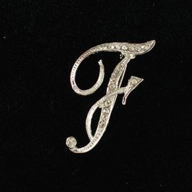 initial brooch F